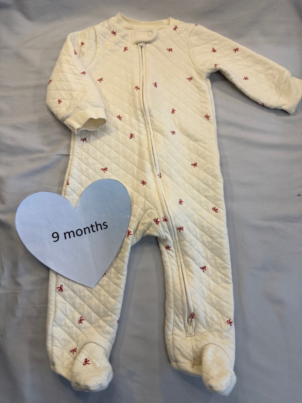 Little planet - organic cotton Cream Quilted Baby Footie with Red Bow Accents